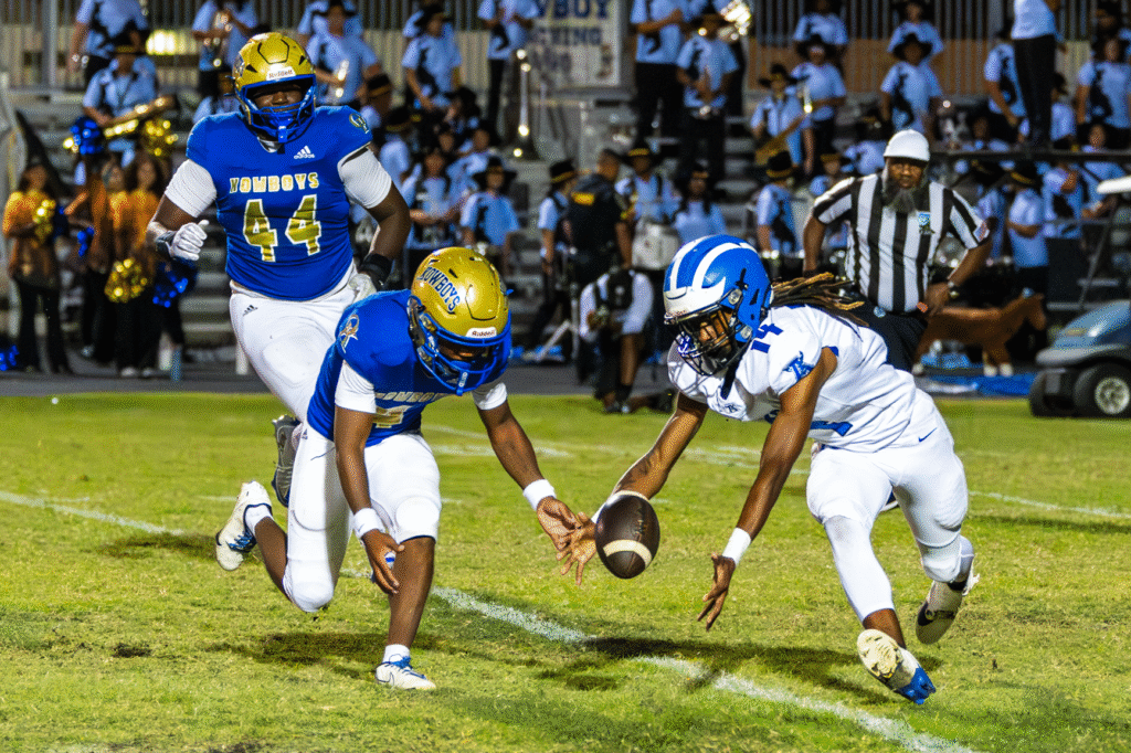 TJ Frazier and a Kowboy duel for the loose ball