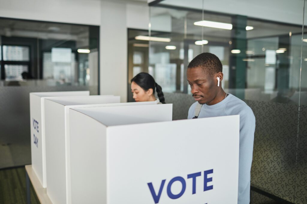 People at voting booths.