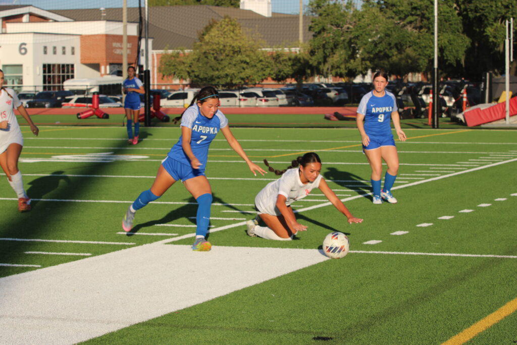 Ariana Obregon tangled up in a battle for the ball