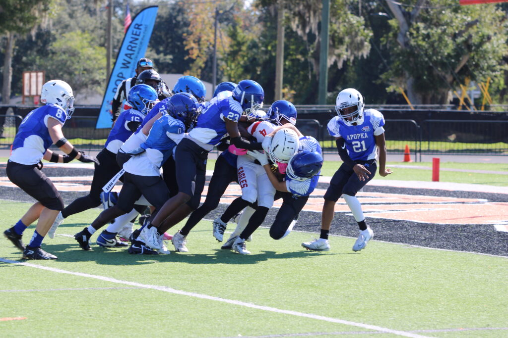 Blue Darters swarm the Eagles ballcarrier, force safety
