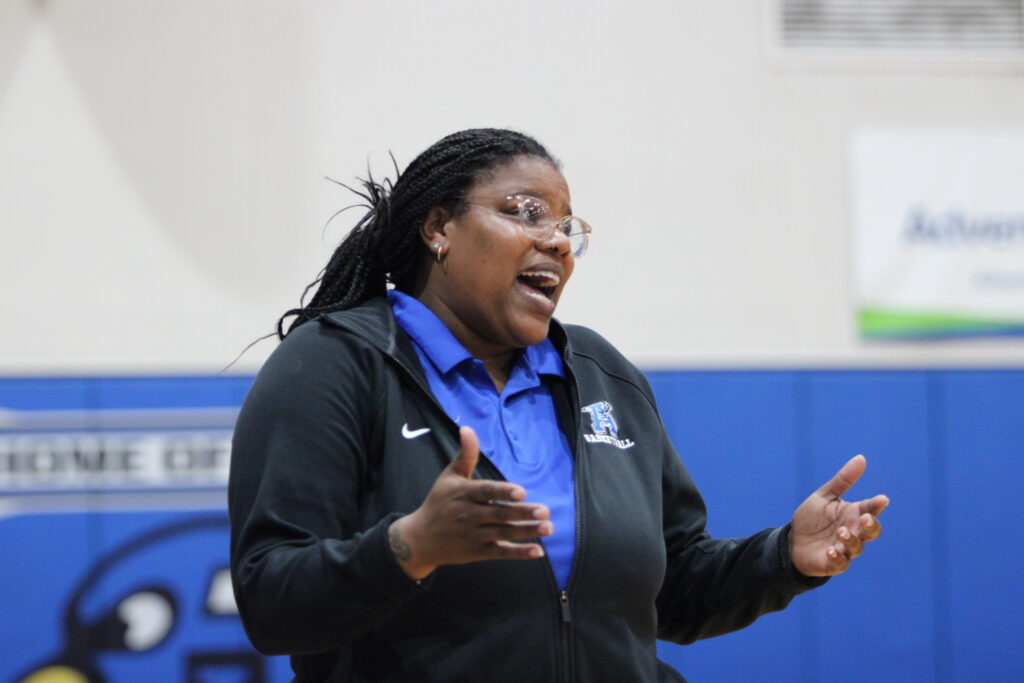 Coach Brittany Hardy guiding the girls from the sideline