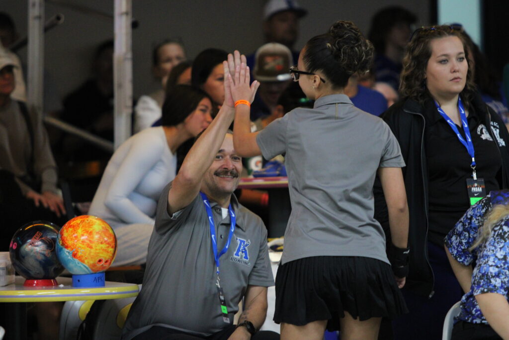 Coach Ramos and Evianna Escalante rejoice after a strike