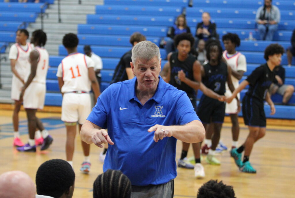 Coach Scott Williams directing the bench on what to do
