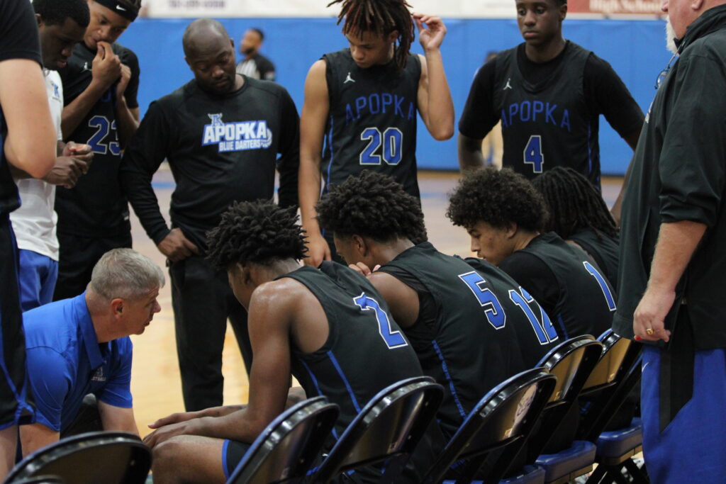 Coach Scott Williams draws up play in final timeout