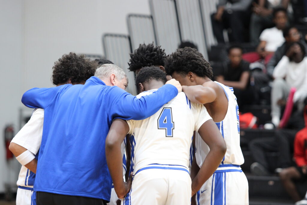 Coach Williams motivates the senior starting lineup pregame