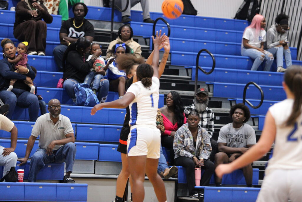 Elyse Pringle heavily contests the three point attempt