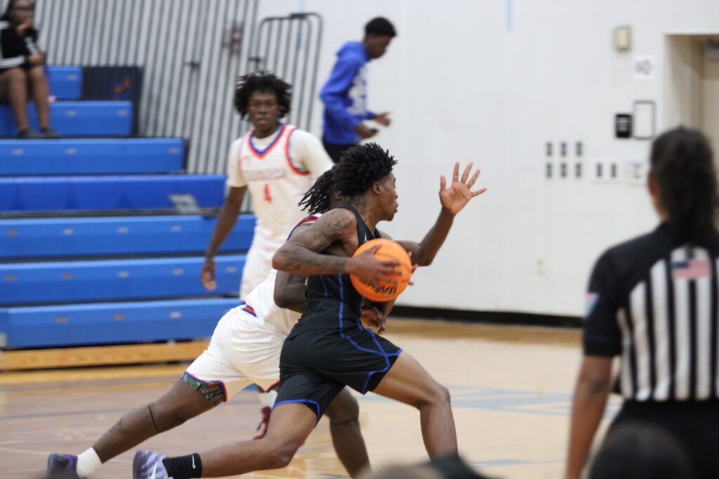 Jarquavion McClain drives hard to the basket