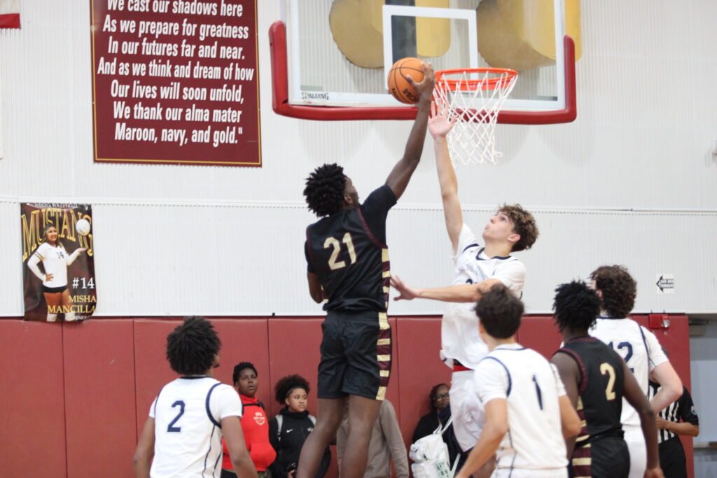 Kenny Diejuste finishes strong at the rack.