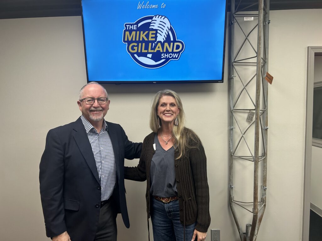 Mike Gilland, host of The Mike Gilland Show, stands with Matthew's Hope president Shelley Bradford at the recording studio for the show.