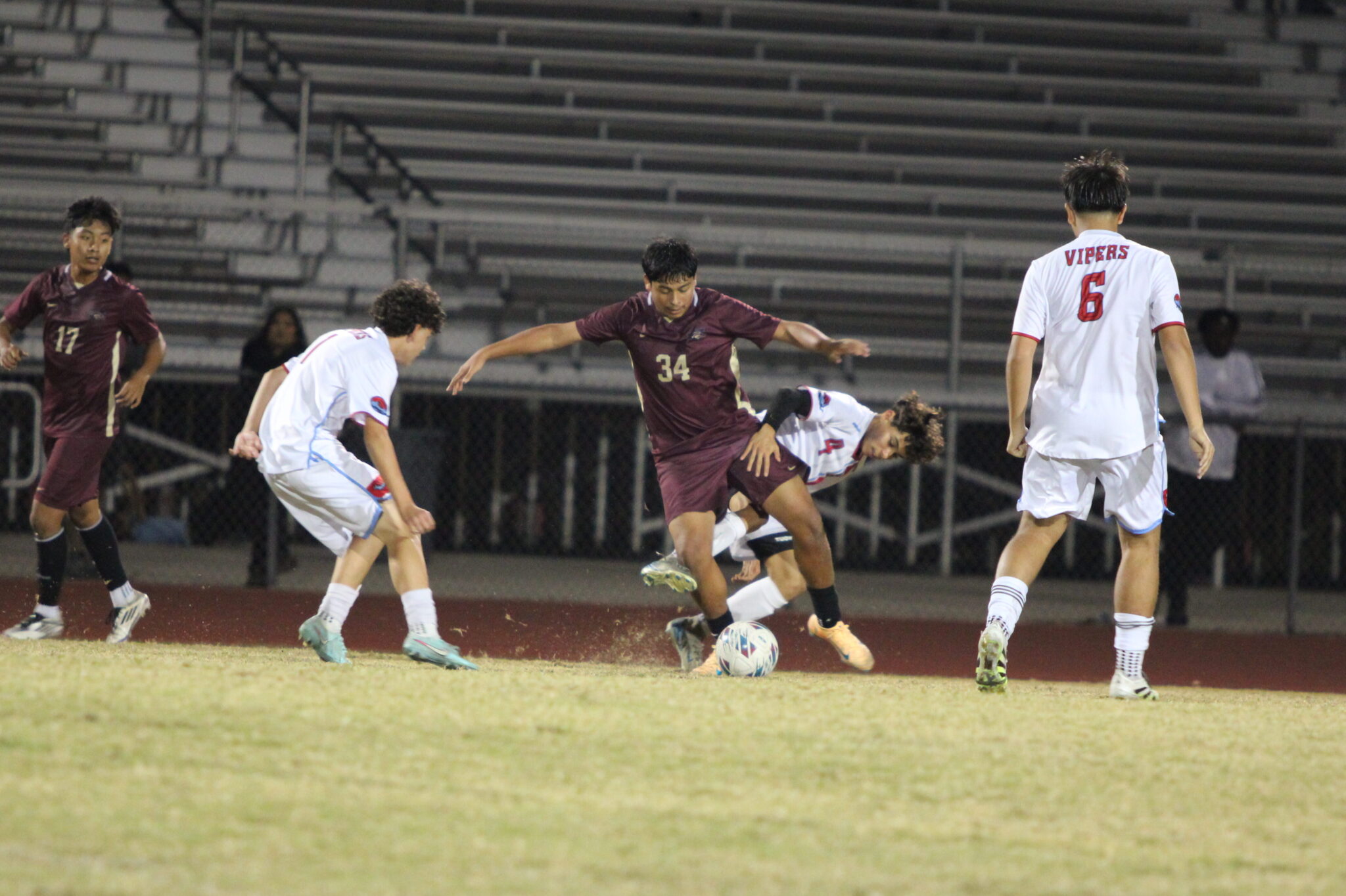Omar Roman keeps the ball away from the defender