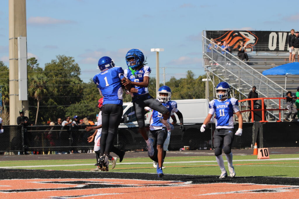Stephens and Dixon celebrate the punt return touchdown