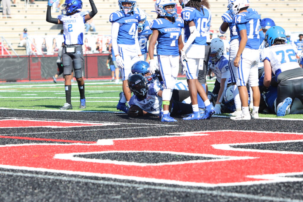 Ty'Rance Cook punches the ball into the endzone