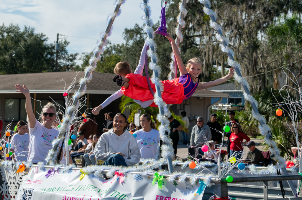 Children perform on the 3D Motion Dance Center float during Saturday's Apopka Christmas Parade.