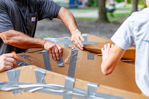 Team members build their racing boats.