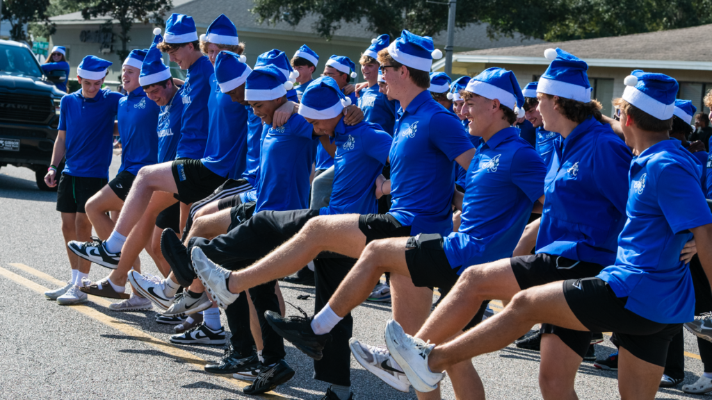 The Apopka Baseball Booster Club dances to Mariah Carey, winning the Parade Judges' Most Unique Performance award.