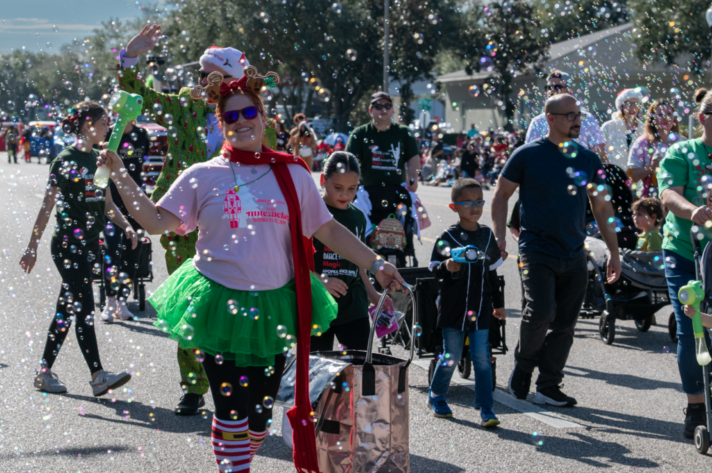 Representatives of the Apopka Dance Center march amidst a flurry of bubbles. The Apopka Dance Center won the Sertoma President's Marching & Performing award.