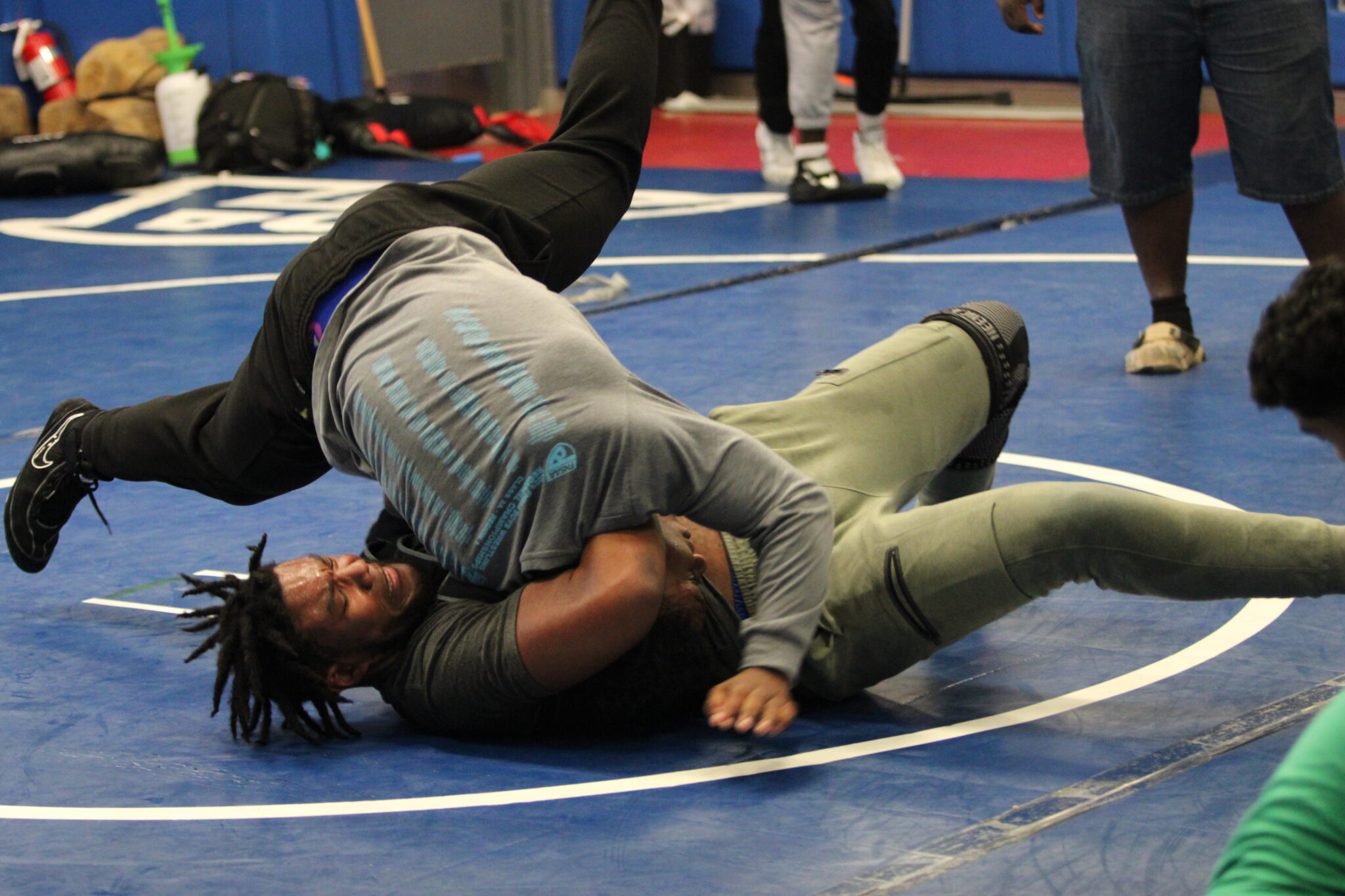 Brandon Roberts holds onto the head lock through Marcus Young's slam