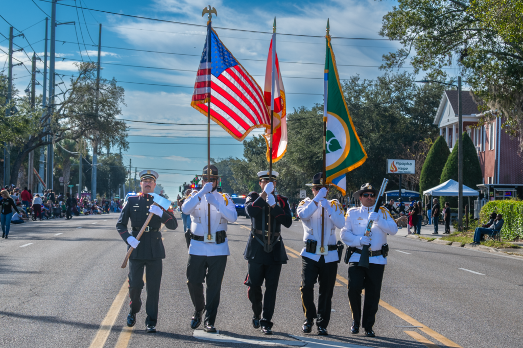 The color guard holds the flags of the United States, Florida and Apopka at the start of the parade.