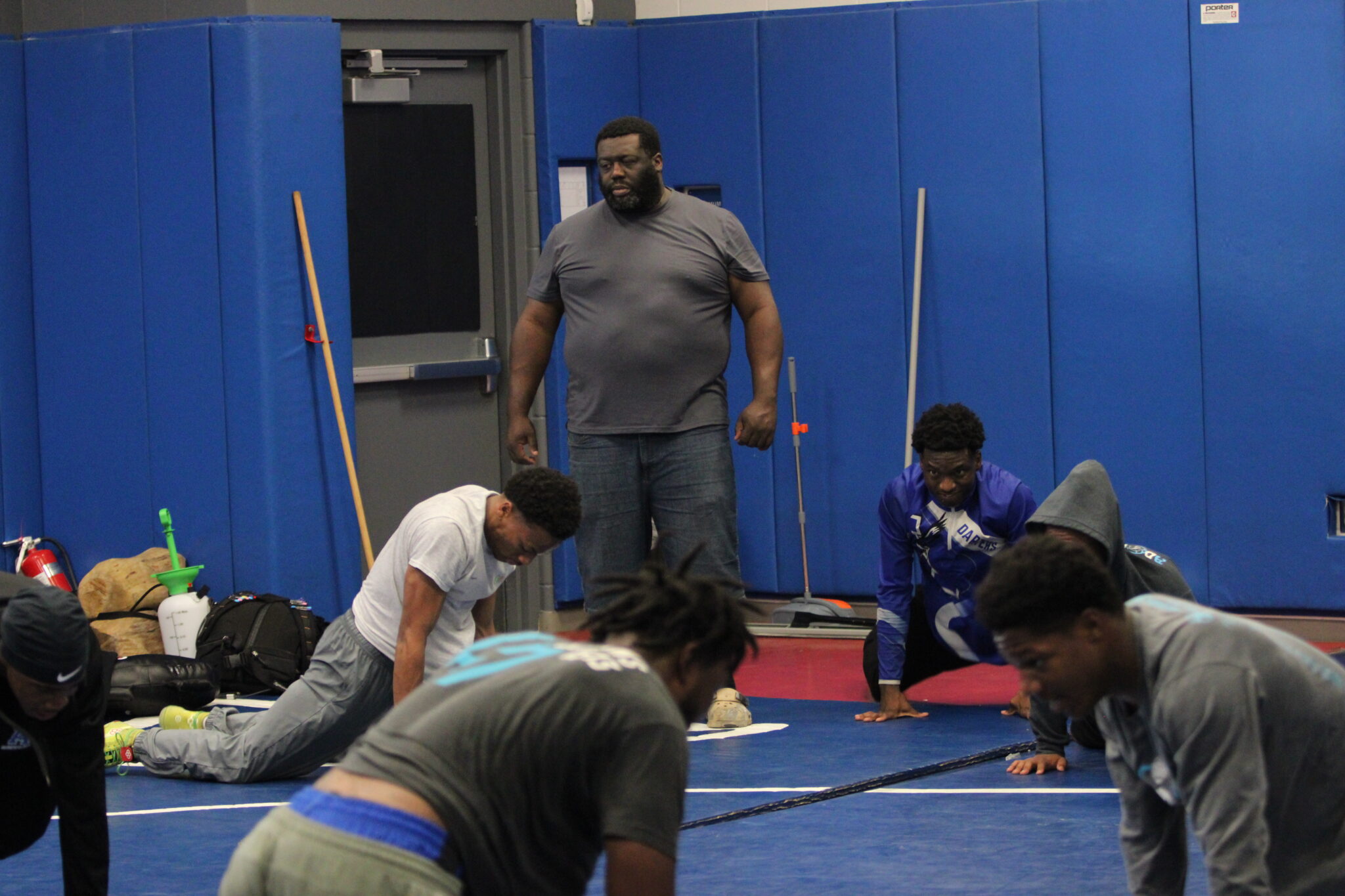 Coach Laroy James Harris pushes the boys through the workout