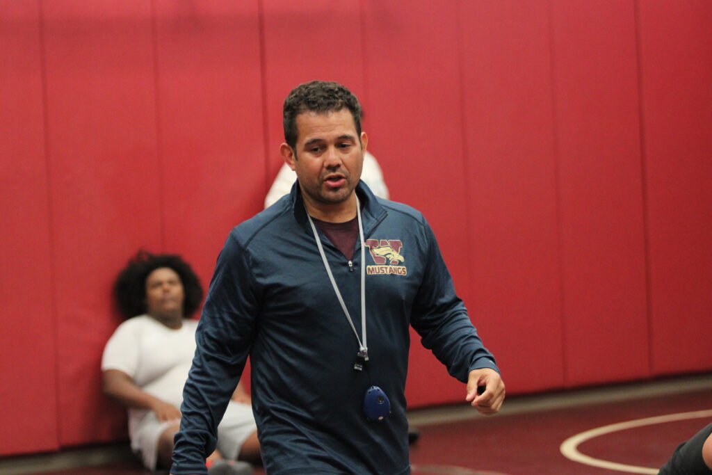 Coach Lenin Vazquez leading the MustangsJPG