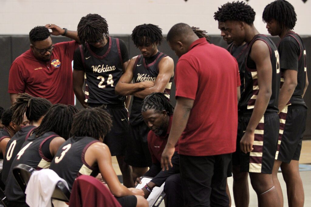 Coach draws up play during final timeout that led to a scoring run