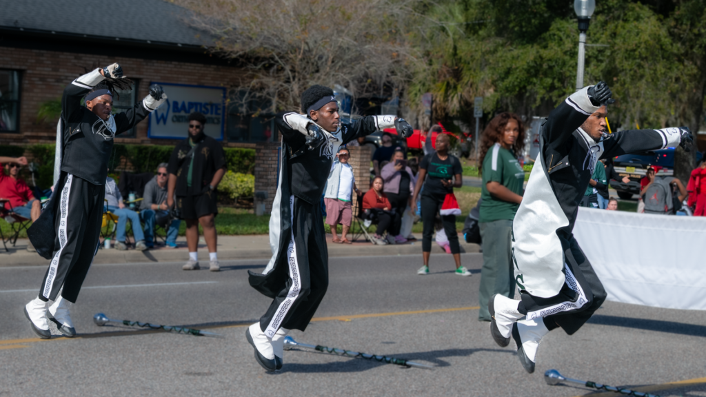 The Green Machine Marching Band from Evans High School performs in the parade.