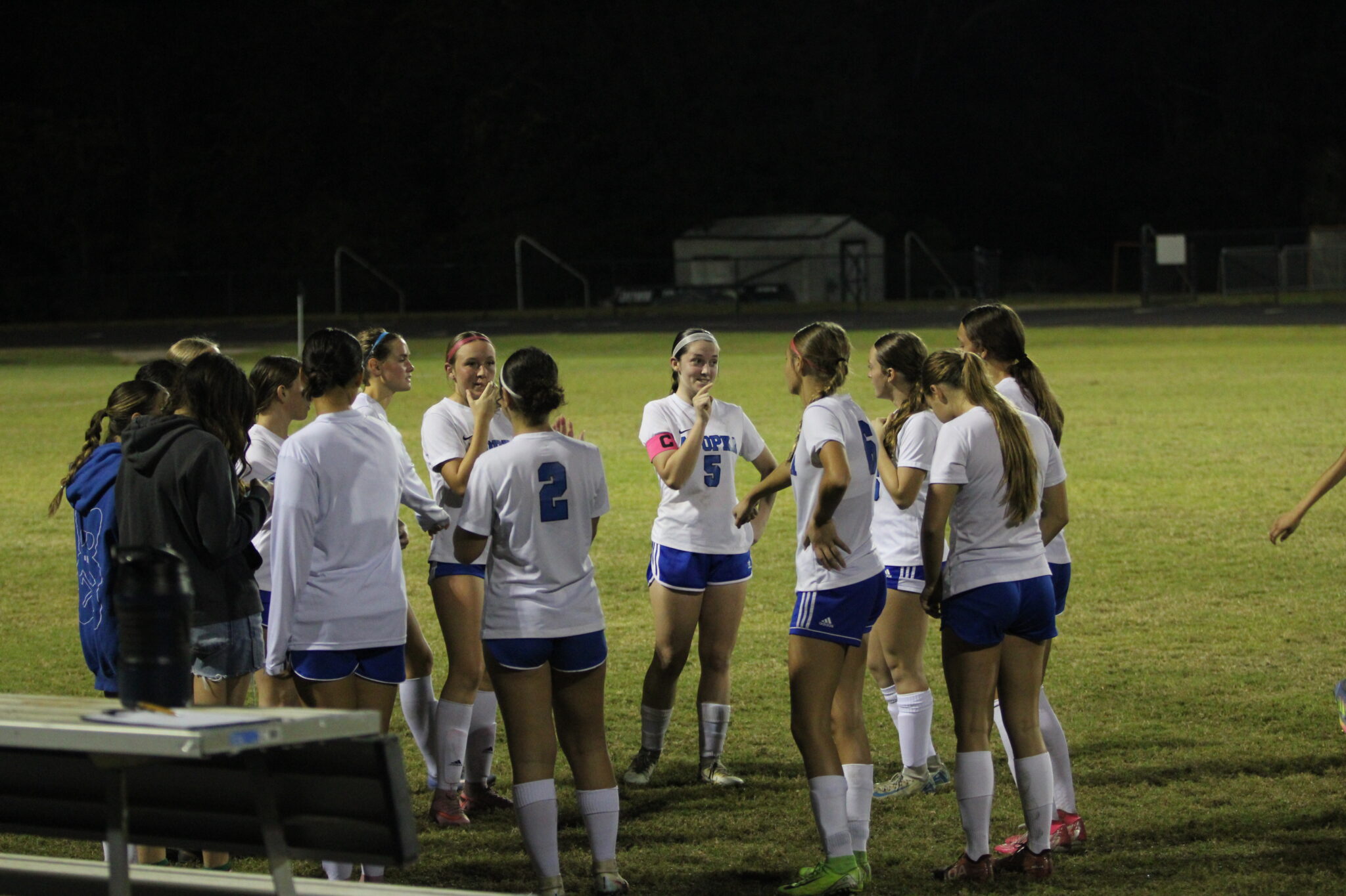 Girls huddle at halftime break
