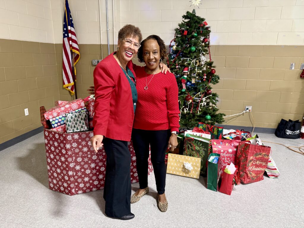 Toy drive chairs Yvonne Williams and Van Carter pose with the donated presents.