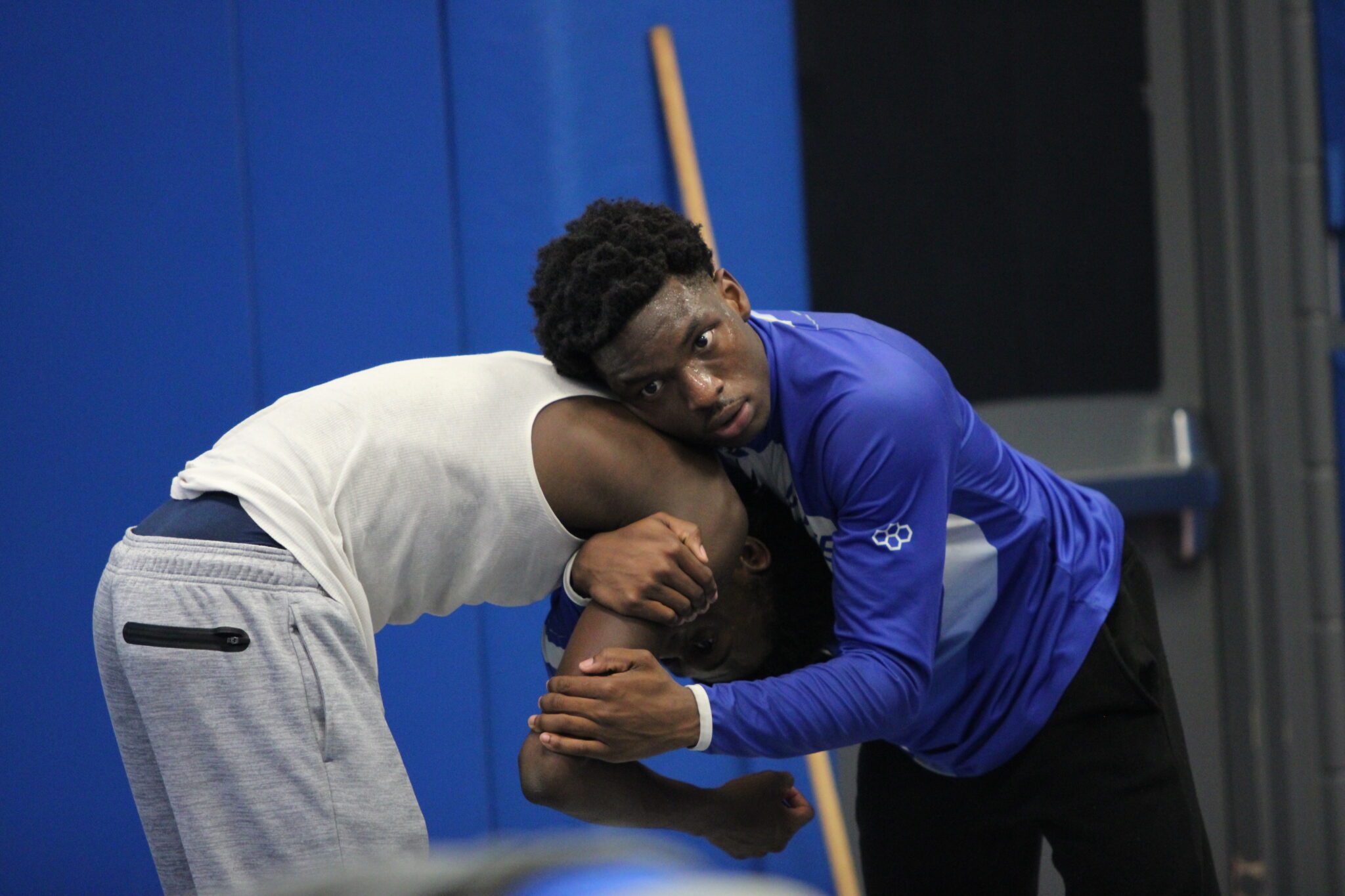 Jaden Battle holds Akil Crawford in drill