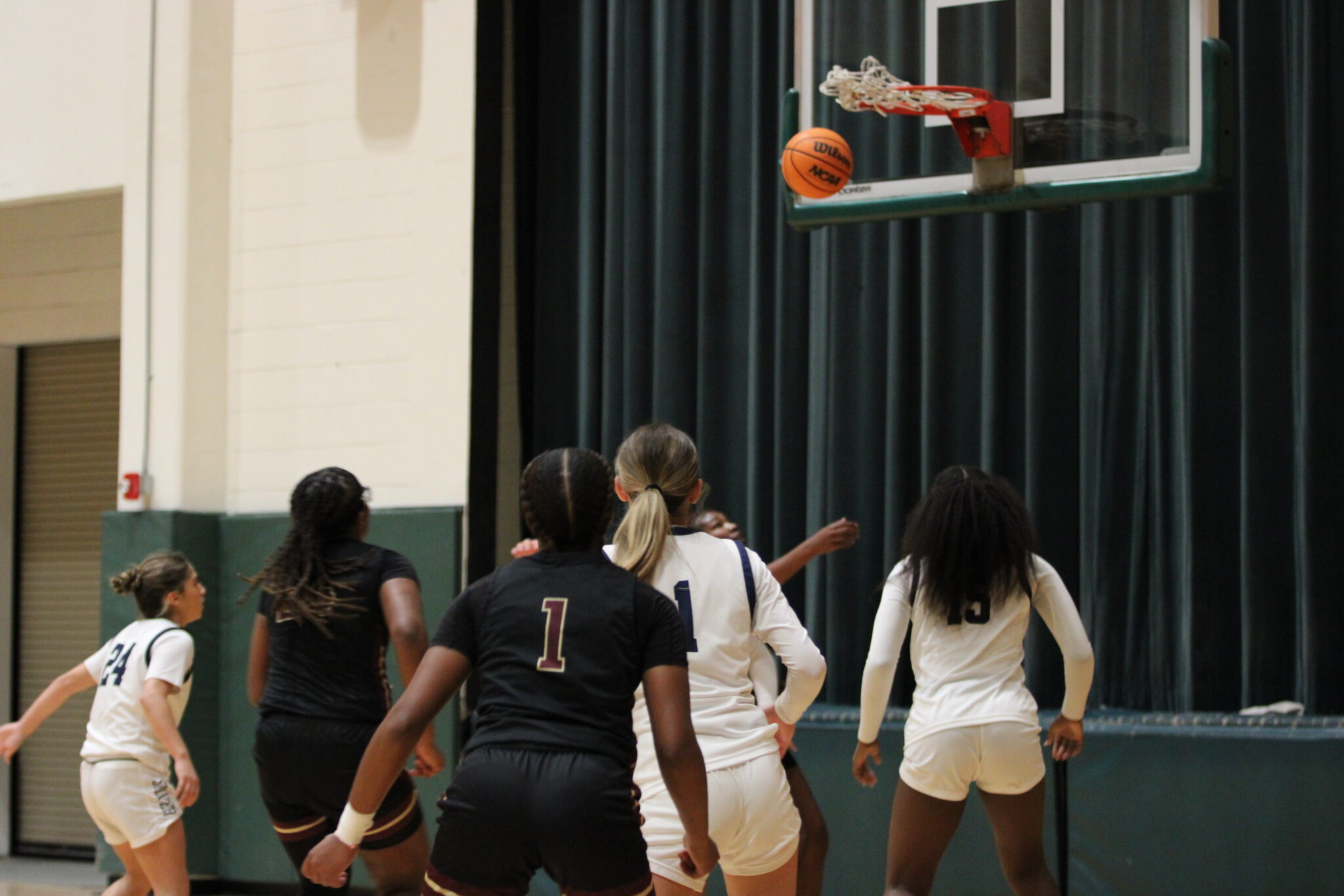 Ja'Niyah Poole watches her 3 go through the net