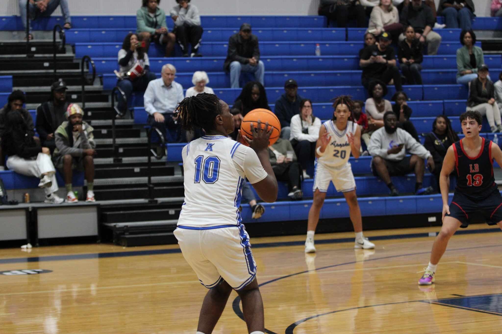 Jacques Evariste lines up the halftime buzzer beater