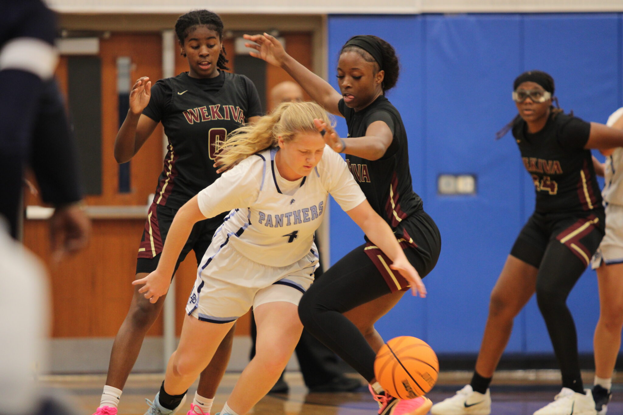 Jakayla Johnson and Jasmine Pooler swarm the Panthers ball handler