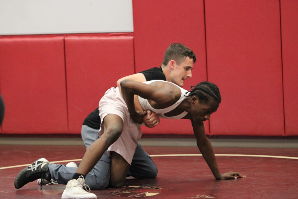 Jeremiah Demosthene tries to break free from Anthony Darwin