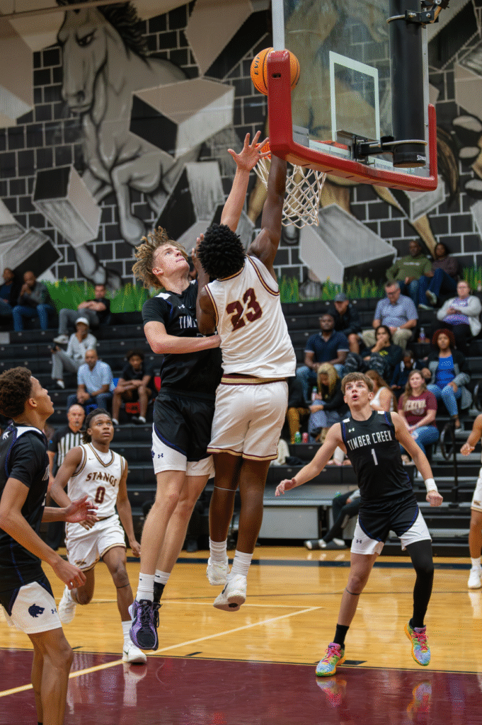 Kaiden Jean-Louis finishes strong against a Wolf in the paint