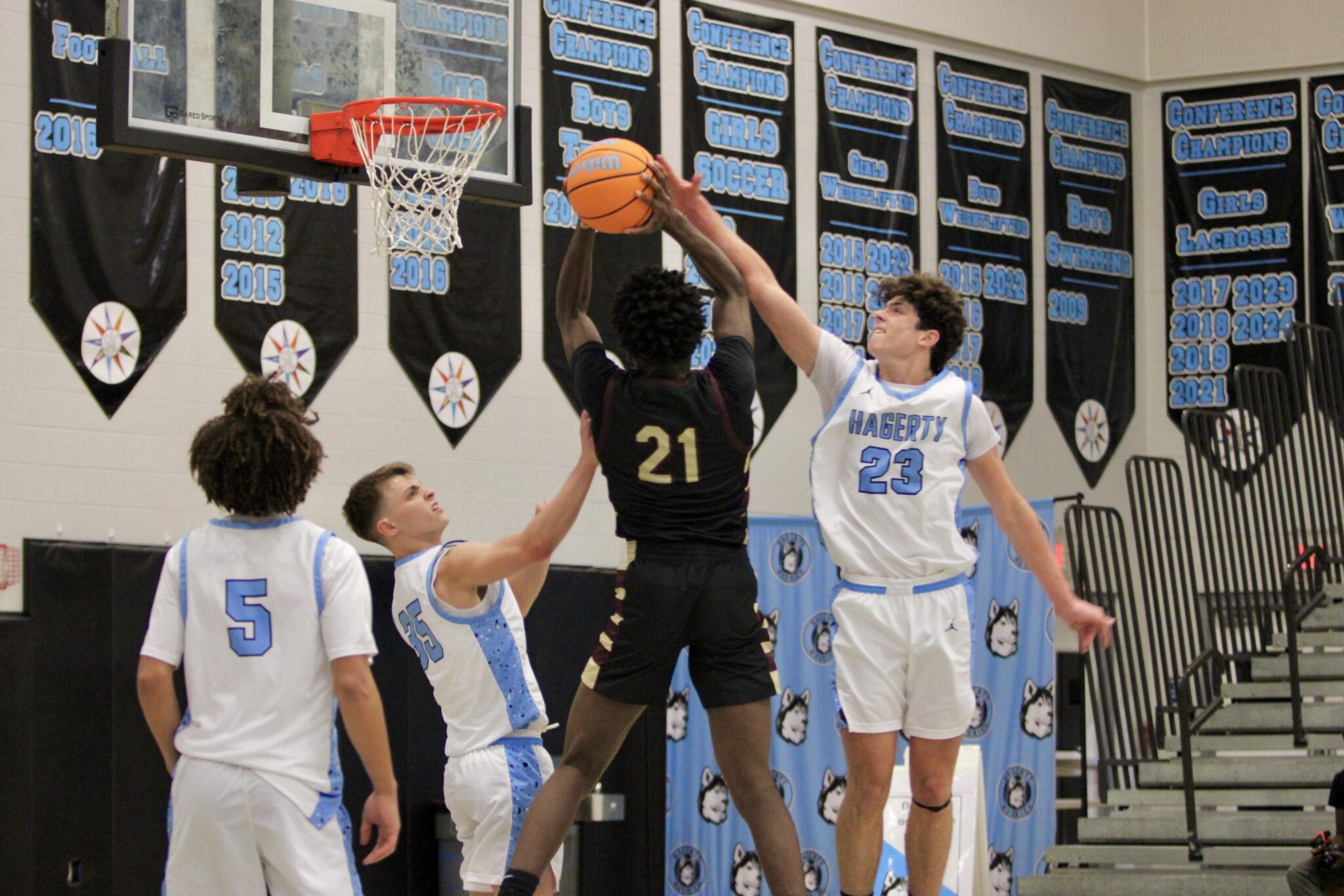 Kenny Diejuste finishes through contact