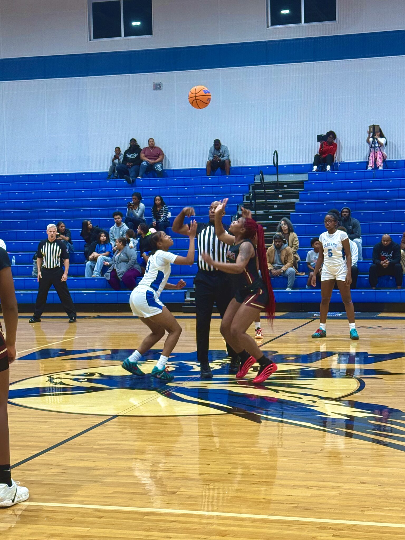 Mikayla Wiggins and Tiana Washington battle for jump ball