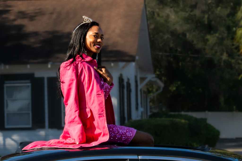 Ms. Florida Petite 2025 Be Edwards wears her crown in the 2025 Apopka Christmas Parade.
