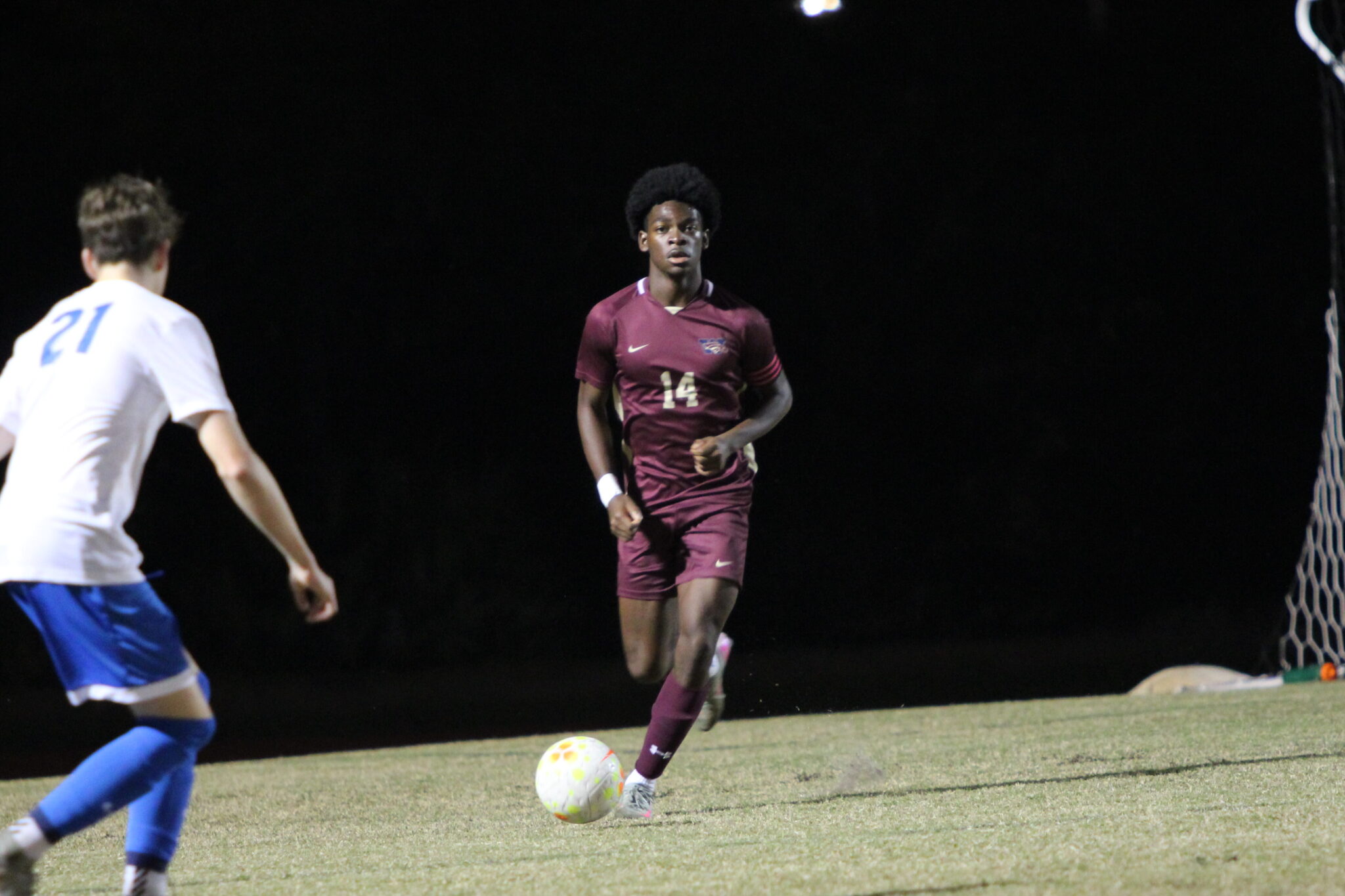 Nathaniel Ellis looks to send the ball up the pitch