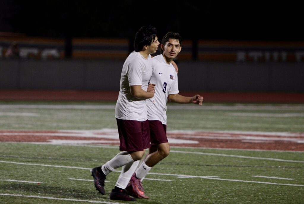 Ricardo Garcia and Jeremiah D'Haiti rejoice after the final whistle, record eighth win of the season