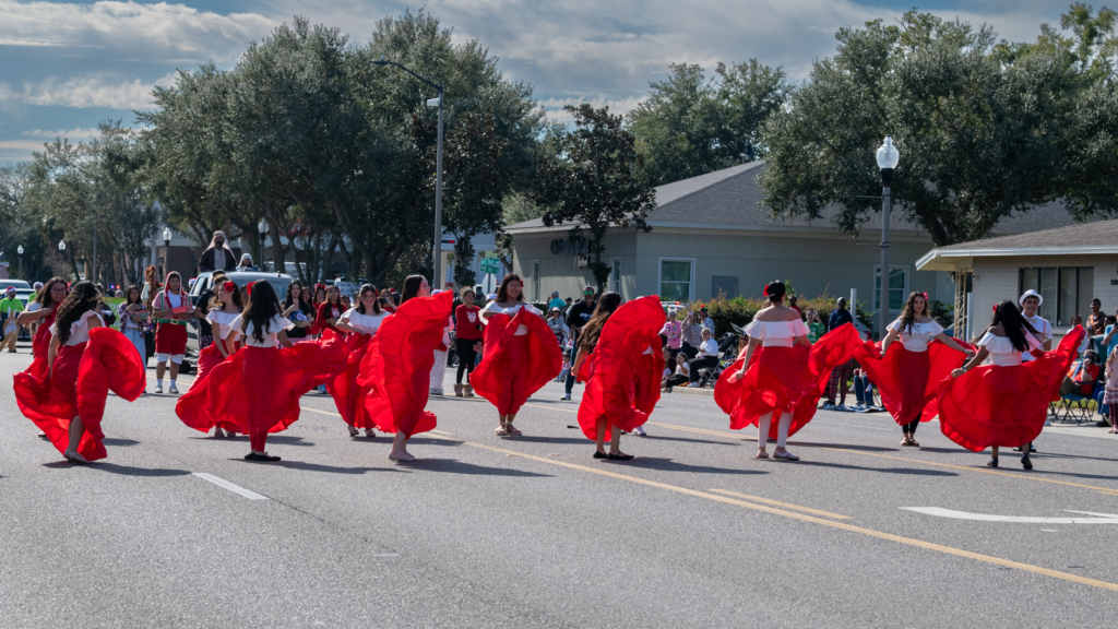 Ladies from the Apopka High School Spanish National Honor Society dance in the parade.