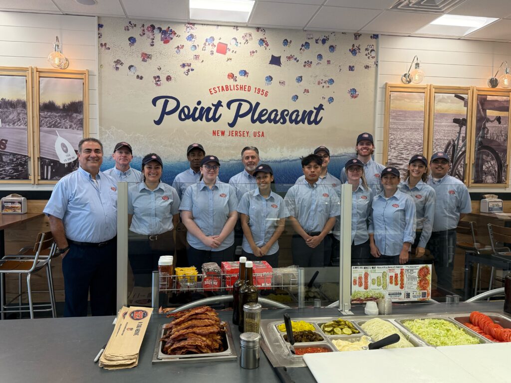The opening day team poses inside the restaurant.