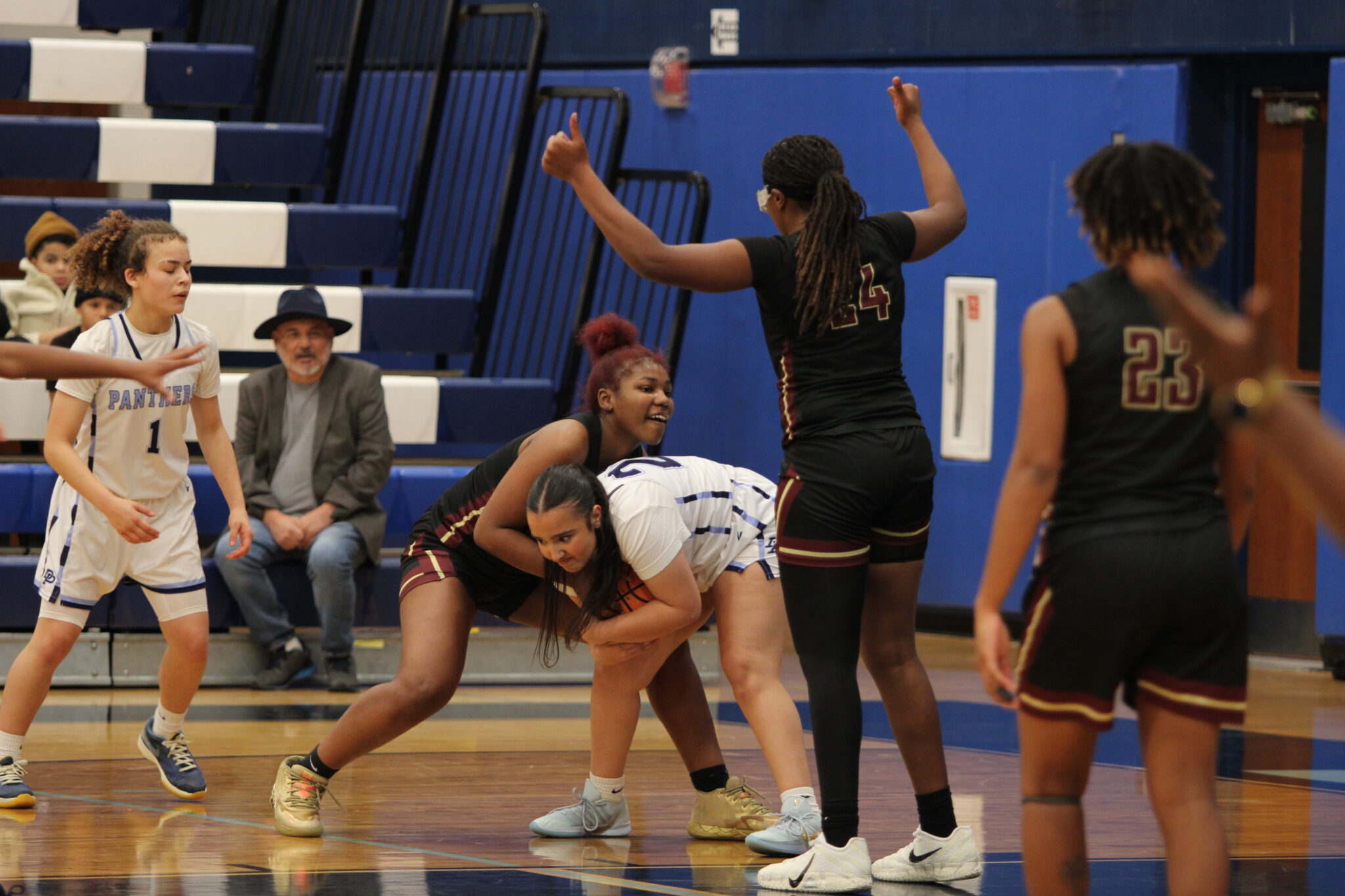 Tiana Washington ties up a Panther for a jump ball