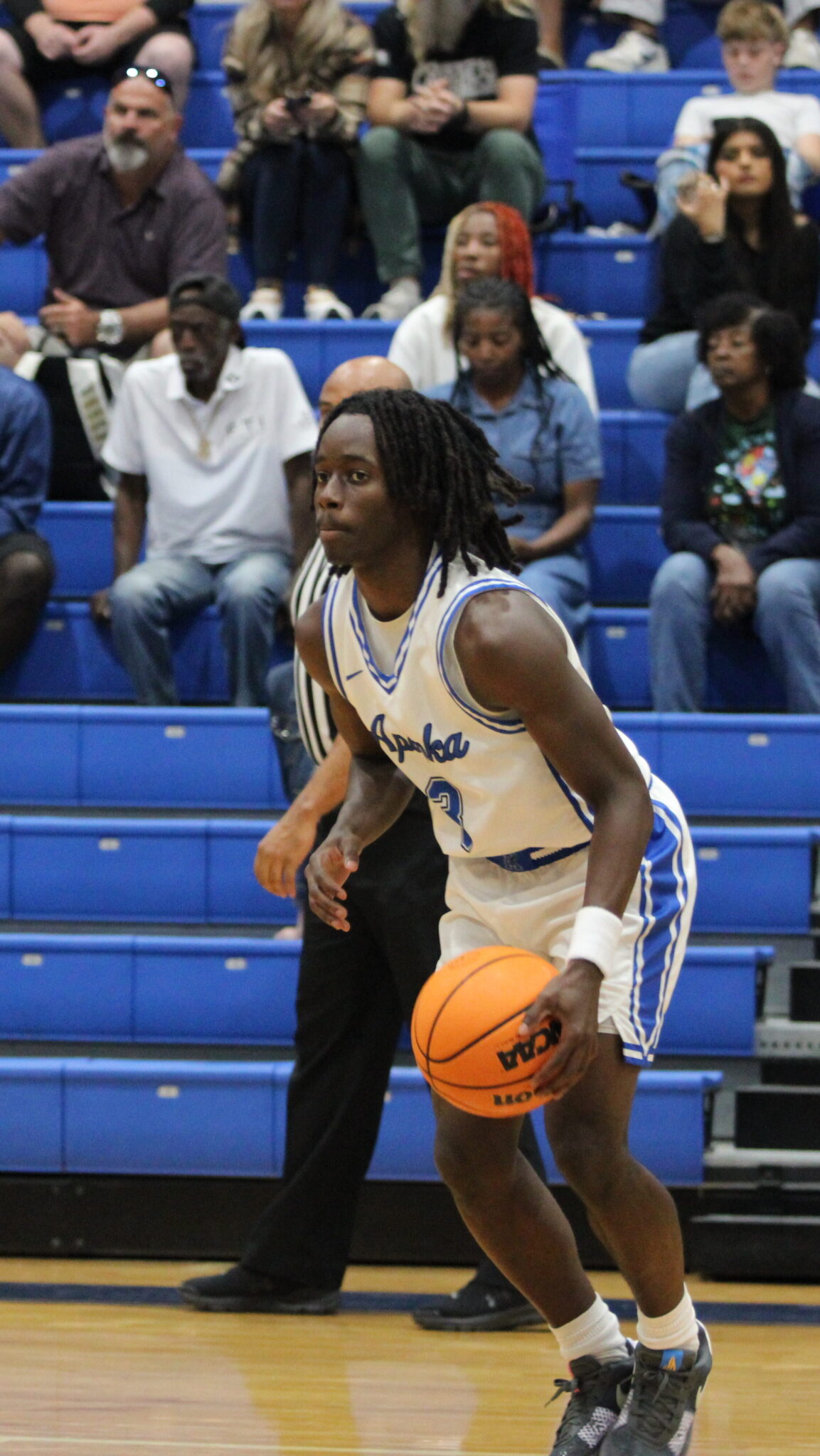 Trent Jean handling the ball at mid court