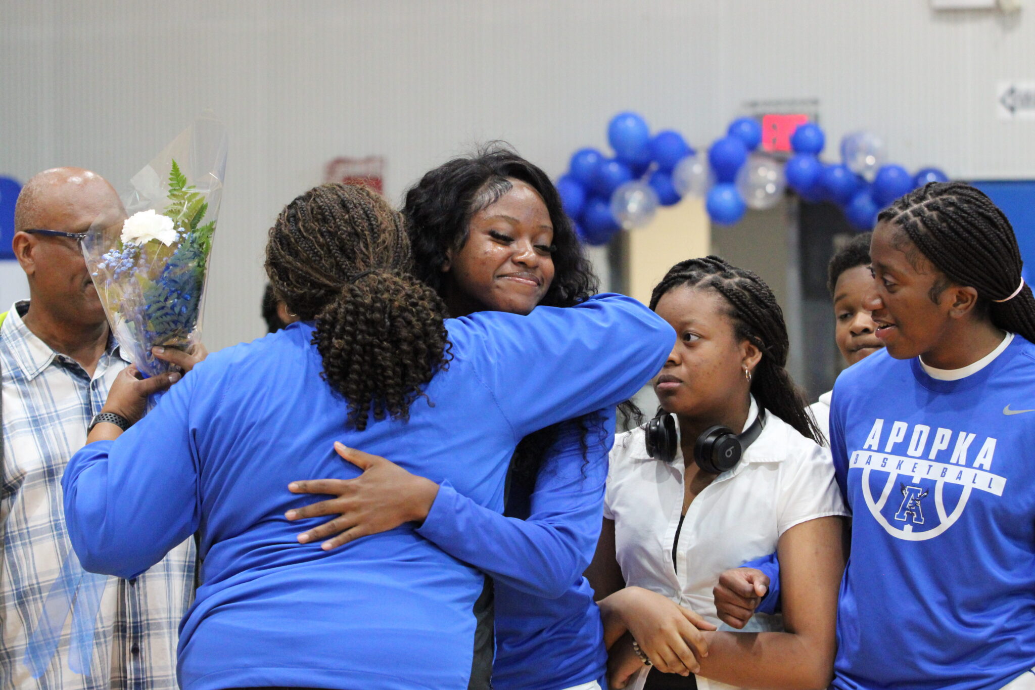 Abigail Henry and Coach Hardy hug