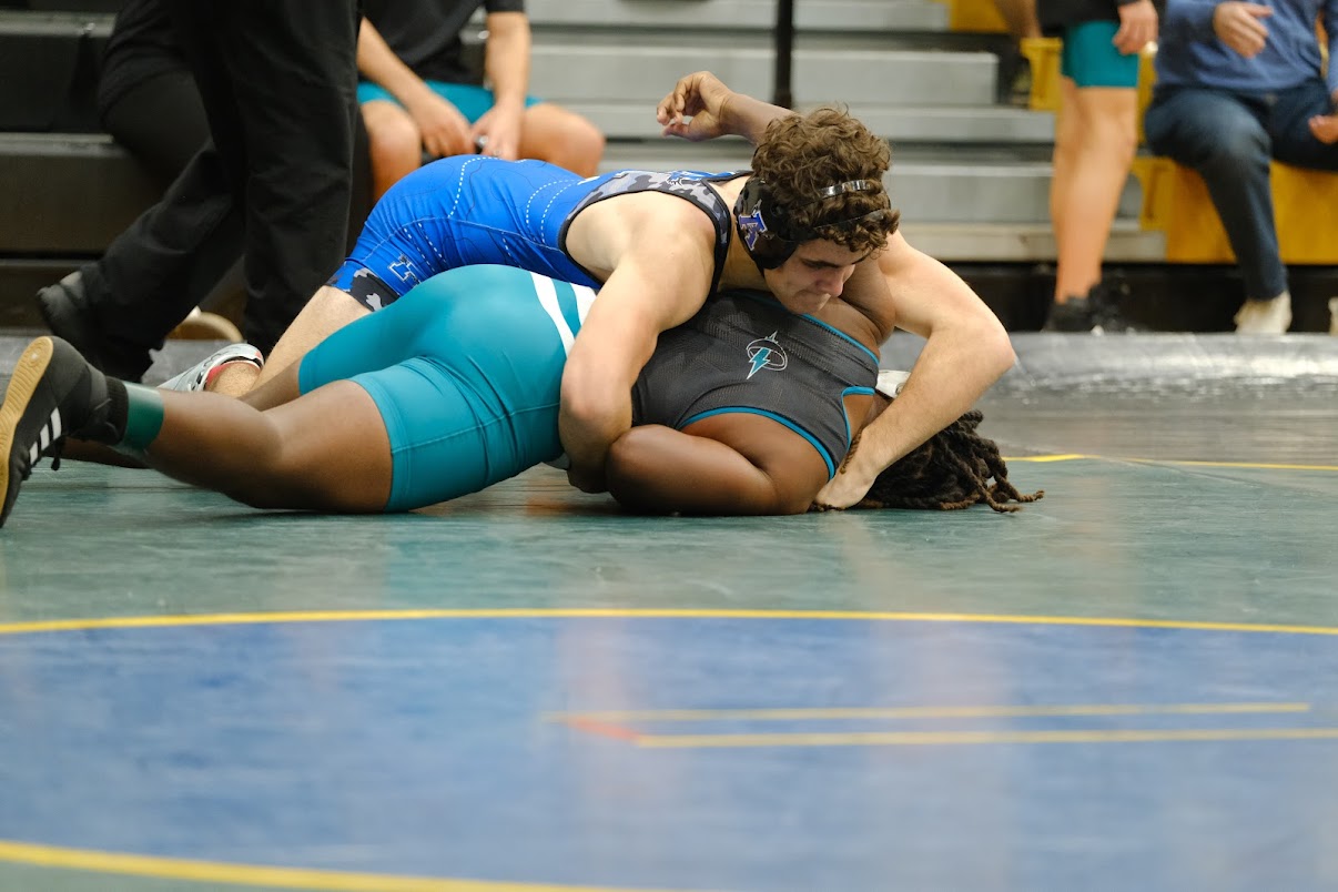 Alex Polusmak flips a Titan to his back for the pin