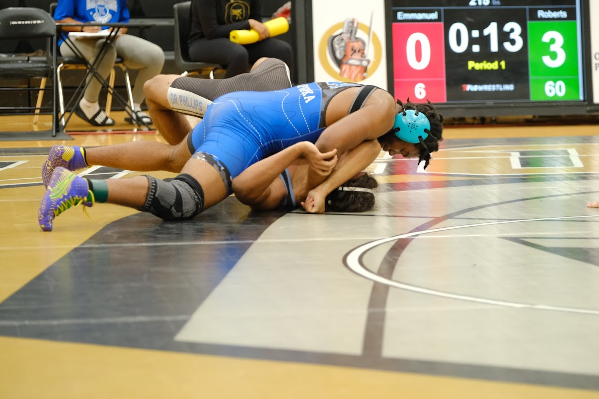 Brandon Roberts holds down and pins a Panther
