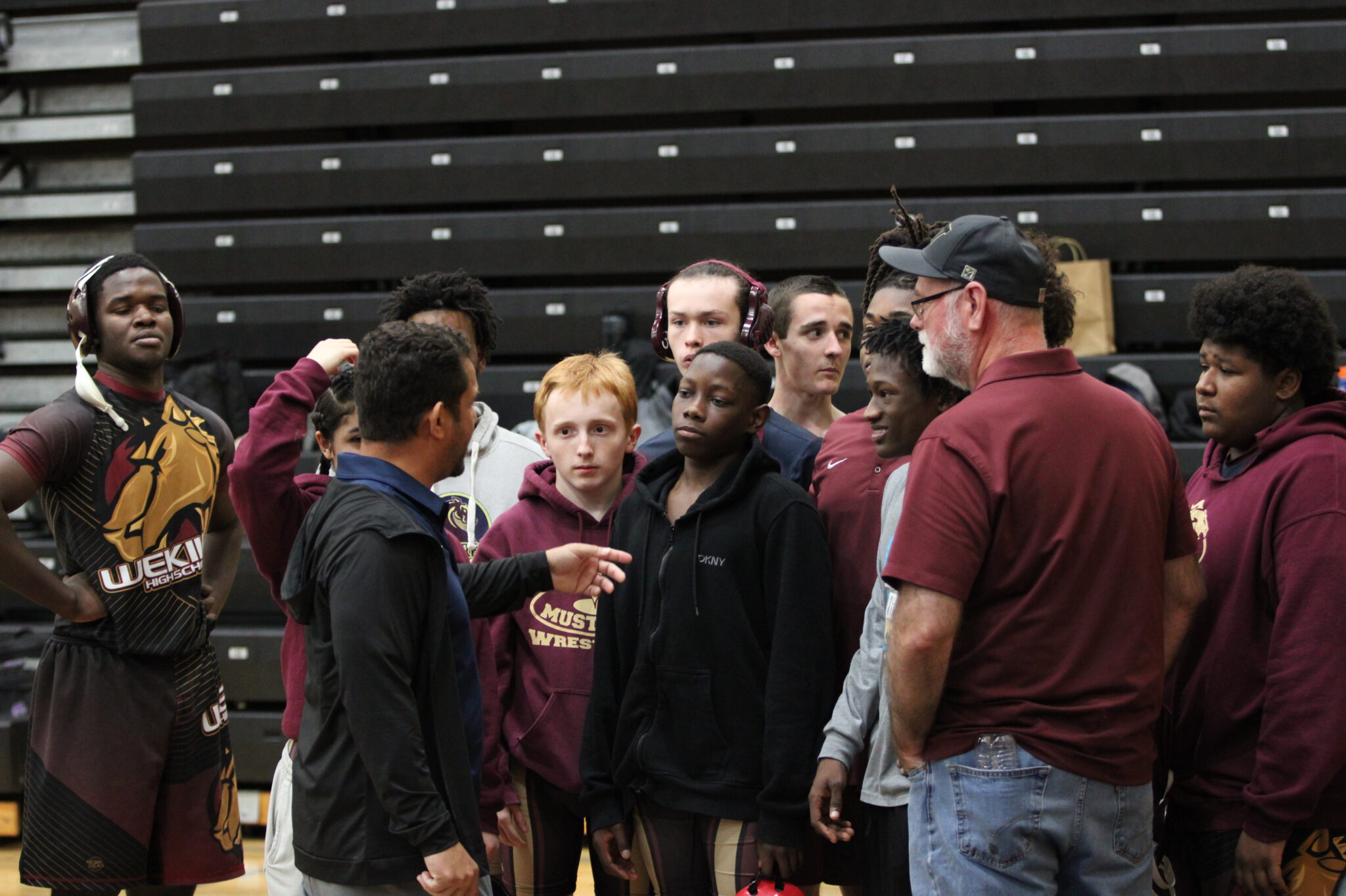 Coach Lenin Vazquez talks to the team after the Dual