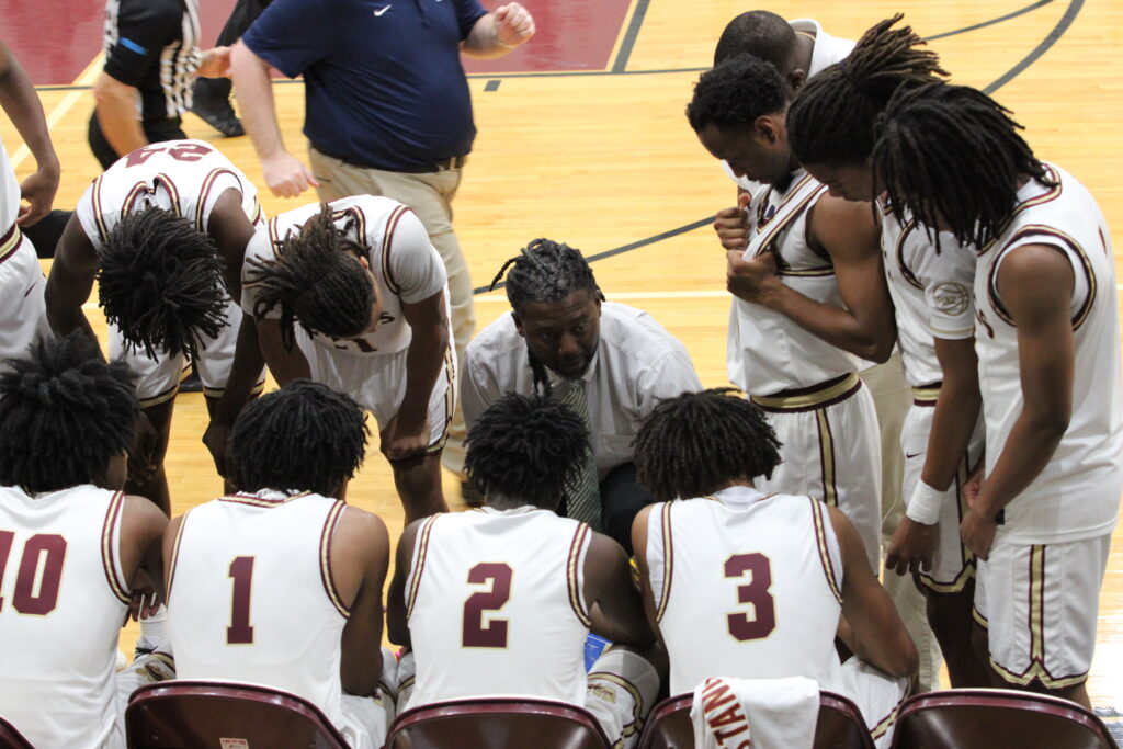 Coach Lubin gets his guys together through a timeout
