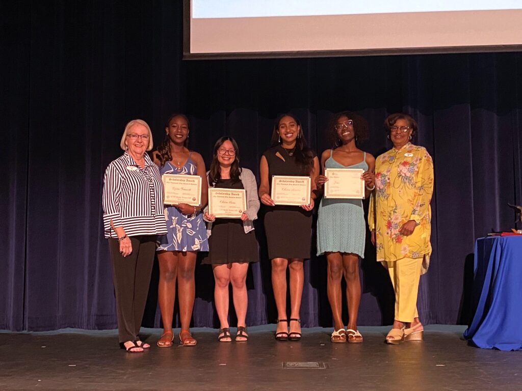 Committee members Christy Faircloth and Marilyn Boyer pose with the 2025 scholarship winners.