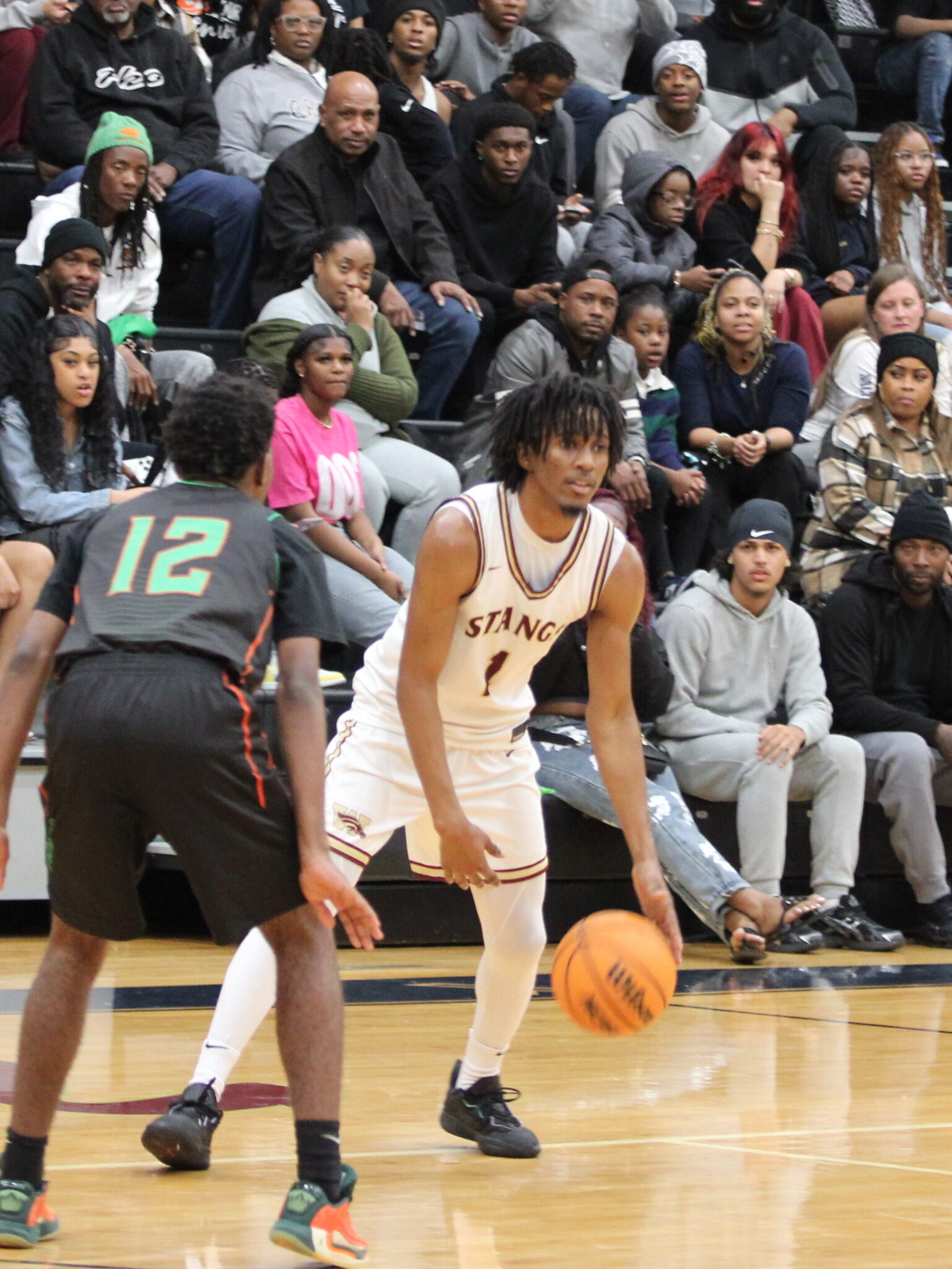 Darion Thomas looks for an open man in the fourth quarter against Jones